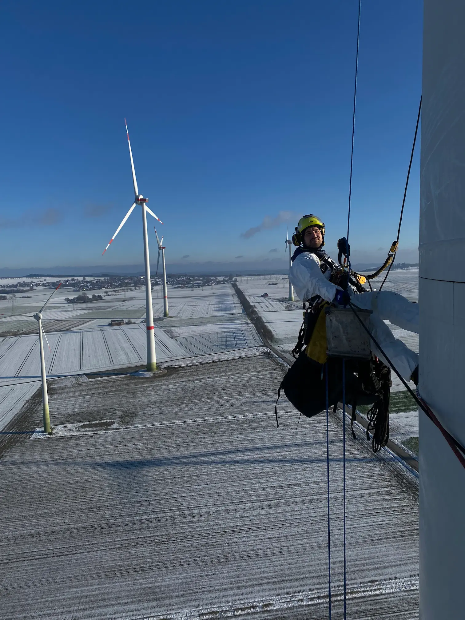 Rope access technician on wind turbine