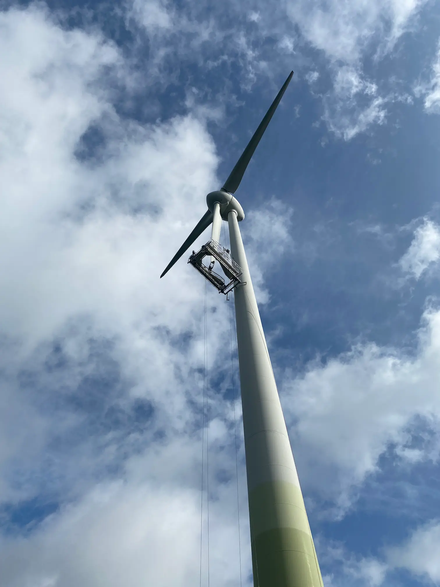 Rope access technician on wind turbine blade